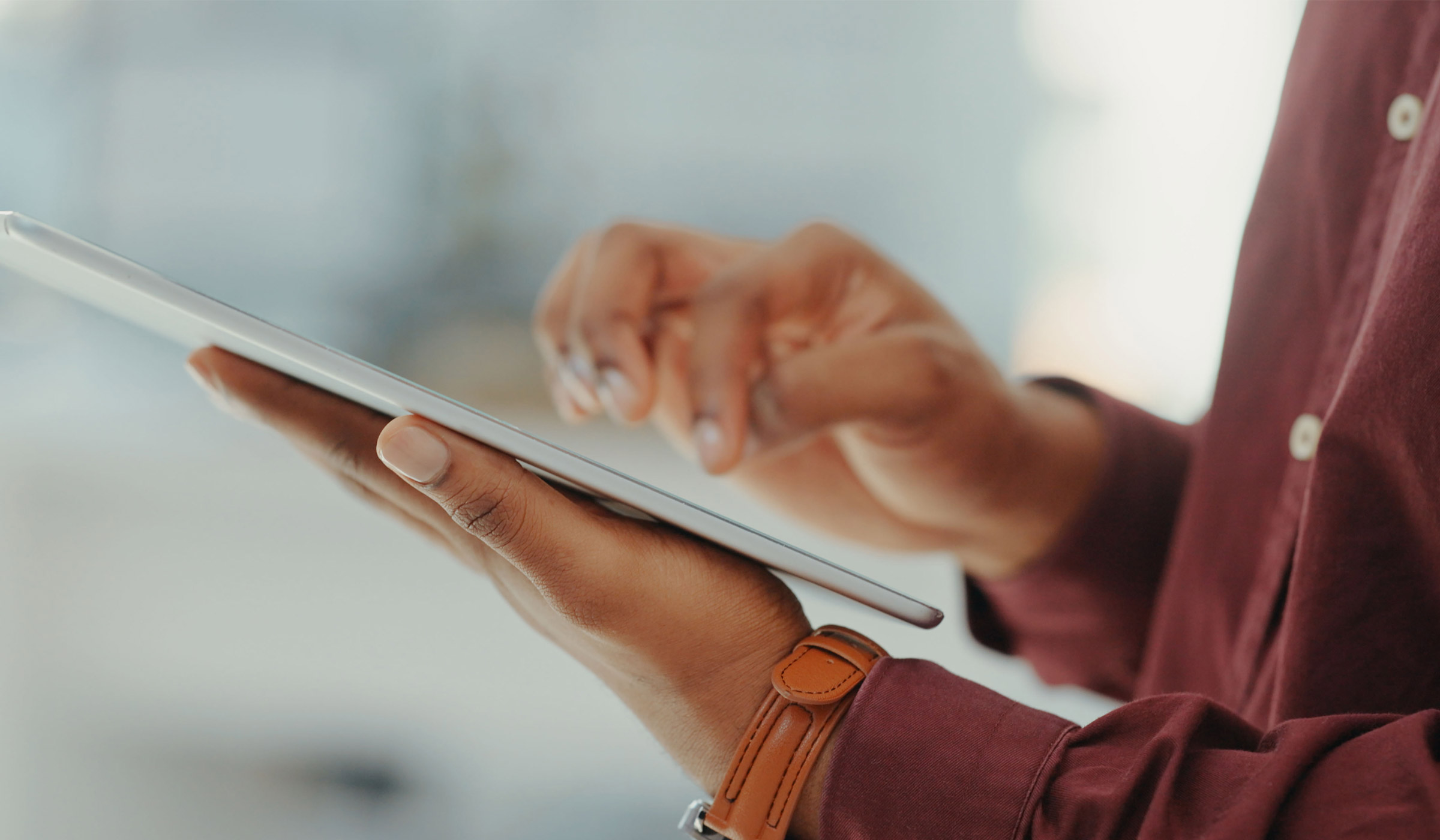 Person using a tablet with one hand
