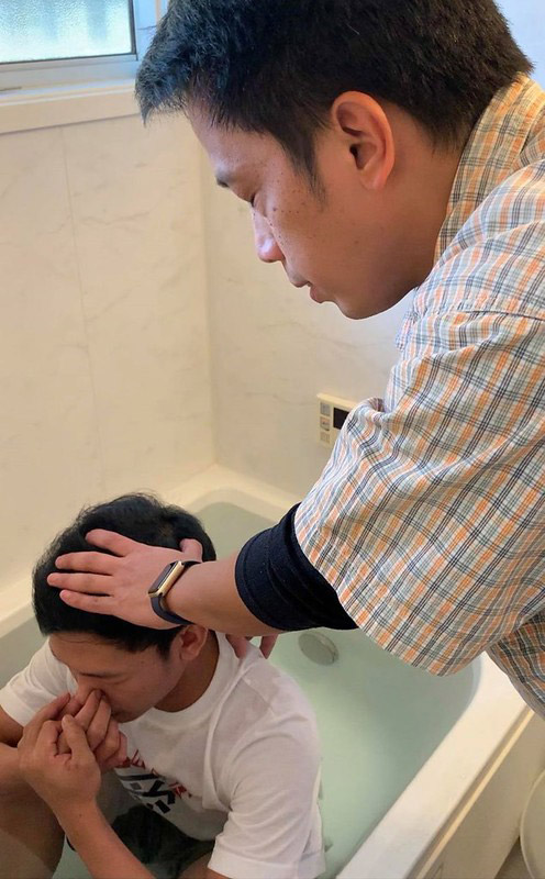 Man performing baptism.