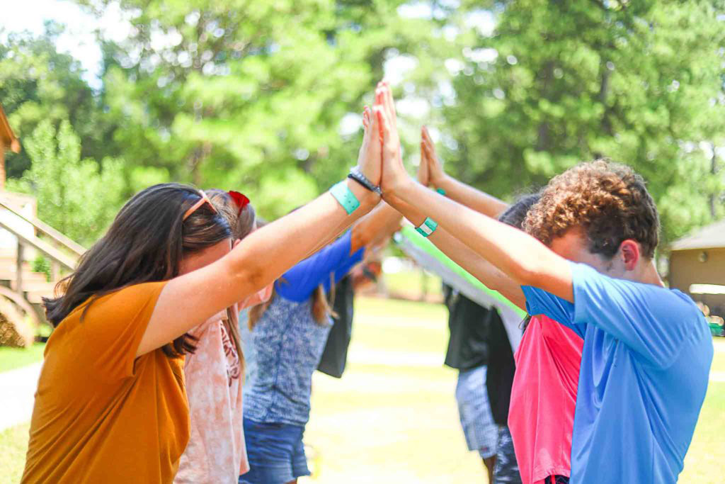 People participating in an outdoor team-building exercise.