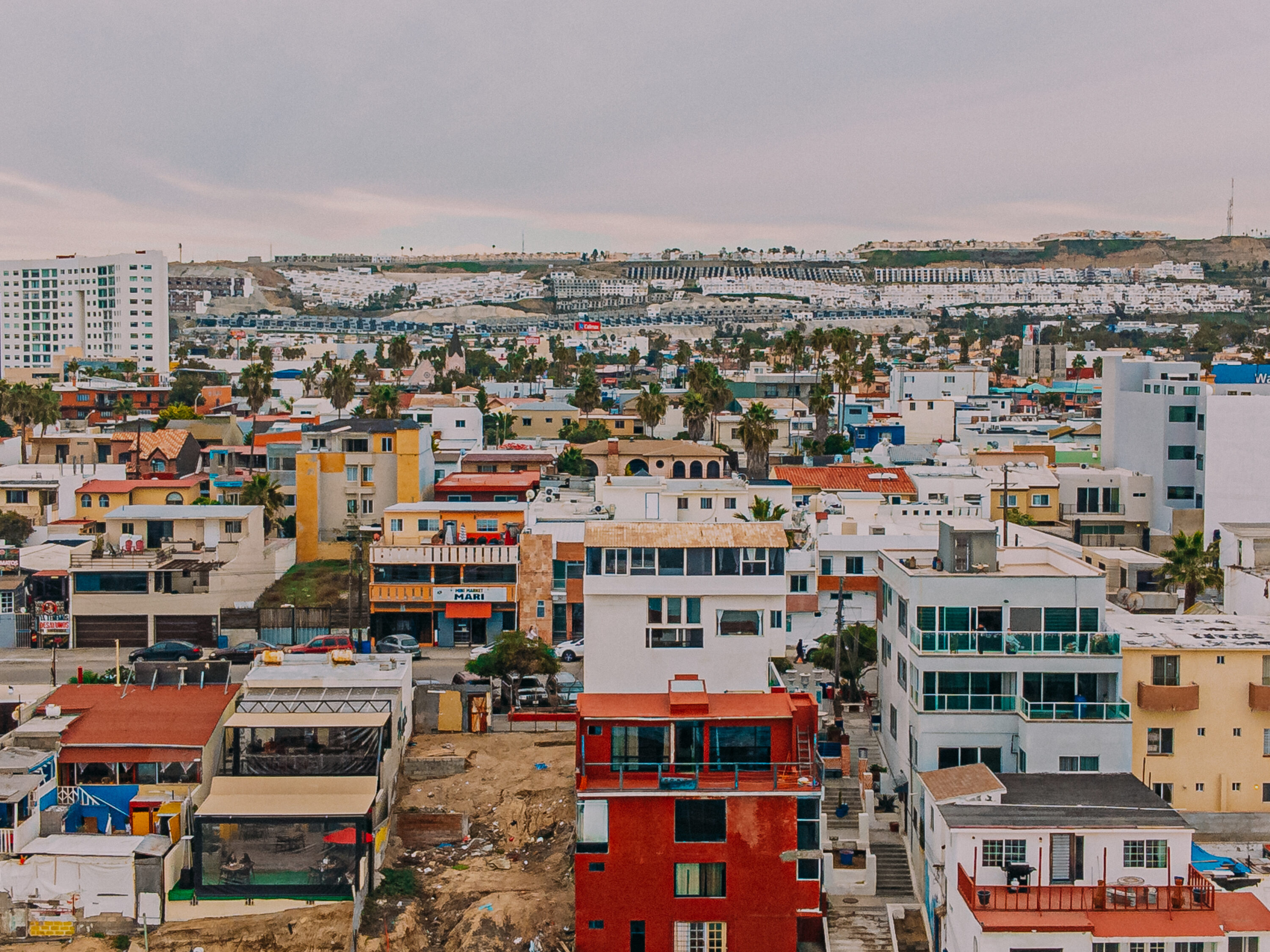 looking east: high angle view of homes and bnbs off the coast of tijuana, mexico on an overcast day