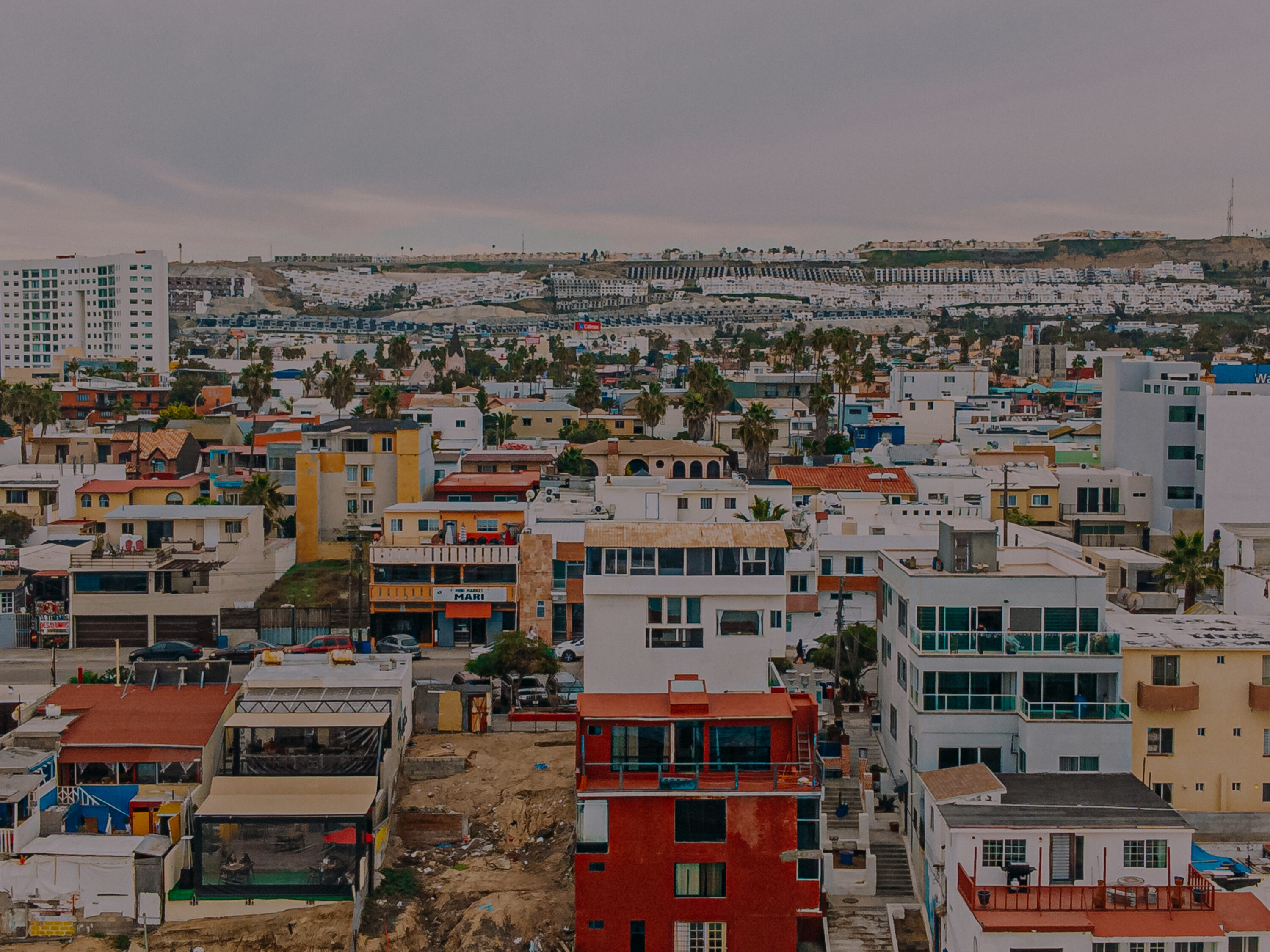looking east: high angle view of homes and bnbs off the coast of tijuana, mexico on an overcast day