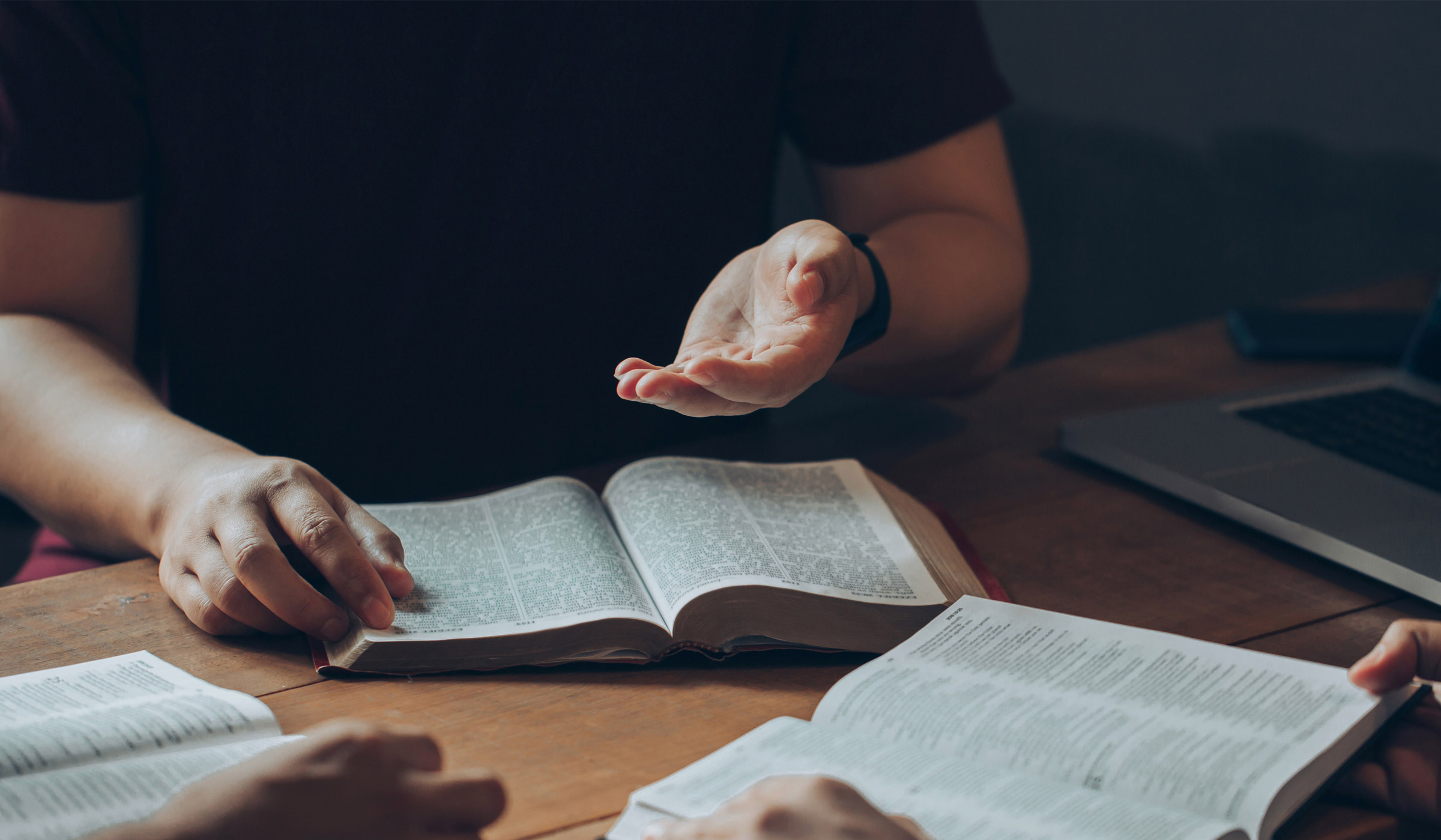 People studying together with open books.